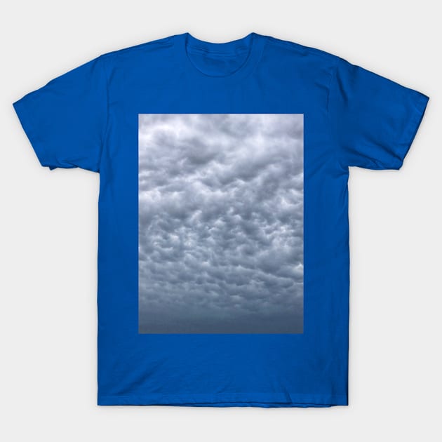 Under cloudy heavenly sky. Blue grey cumulus cloudscape T-Shirt by Khala